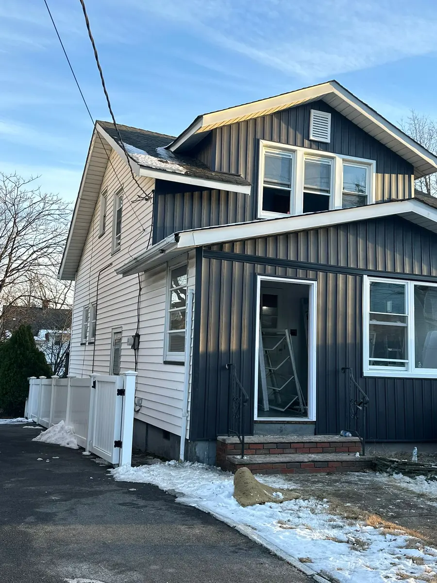 Completed siding project by SSKM Construction