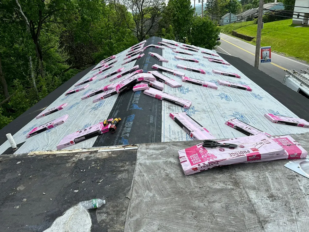 New shingle roof installation in progress